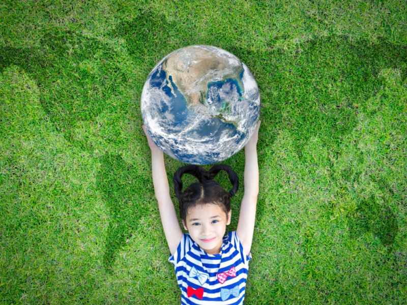 A child holding a globe
